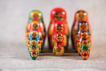 Russian dolls. Matryoshka on linen fabric for the background.