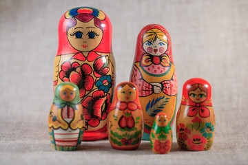 Russian dolls. Matryoshka on linen fabric for the background.