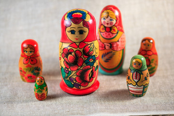 Russian dolls. Matryoshka on linen fabric for the background.