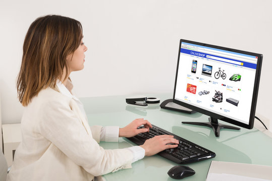 Businesswoman Shopping Online On Computer Desktop