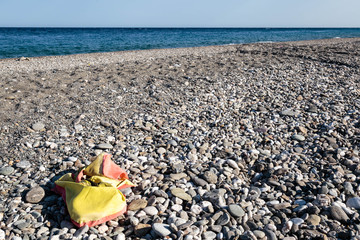 Abandoned lifevest on a beach in Sicily