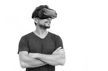 man in dark T-shirt wearing virtual reality 3D headset and exploring the play
