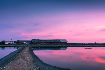 Fototapeta premium Beautiful landscape at sunset salt Farm. Salt Farm is the place with so much sea-salt production in the country, Thailand.