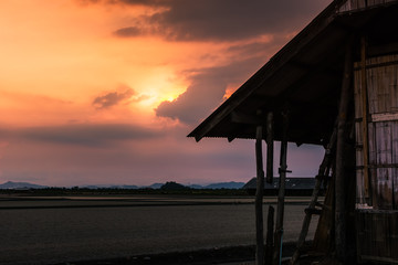 Beautiful landscape at sunset salt Farm. Salt Farm is the place with so much sea-salt production in the country, Thailand.