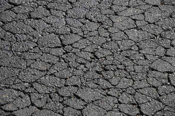 cracked asphalt road surface texture