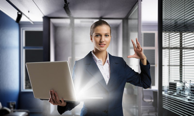 Woman with laptop in hands . Mixed media