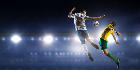 Fototapeta na wymiar Soccer palyers fighting for ball