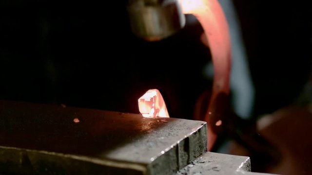 Glowing Horseshoe Hammering Slow Motion 01