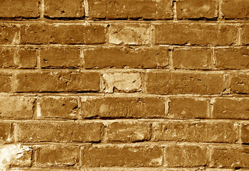 Weathered orange toned brick wall texture.
