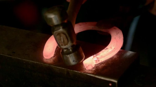 Glowing Horseshoe Hammering Slow Motion 02