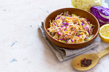 Salad coleslaw in a wooden bowl, rustic style, copy space