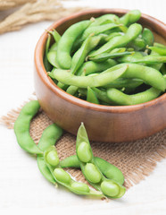 Green Japanese Soybean in wooden bowl on table wood