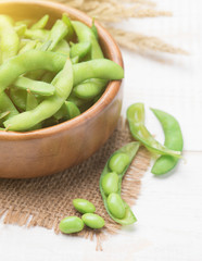 Green Japanese Soybean in wooden bowl on table wood