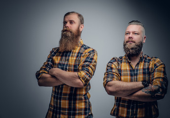 Obraz premium Two bearded men in a plaid shirt.