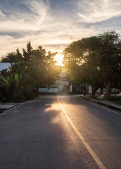 Obraz premium Rural asphalt road at sunset