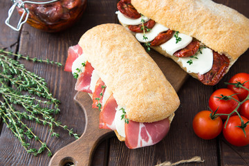 assorted sandwiches. sandwich Caprese with mozzarella and sun-dr