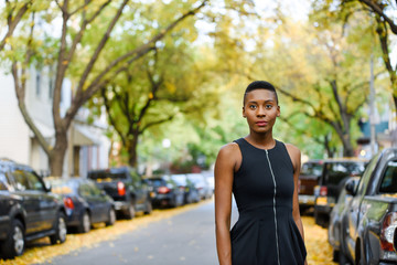Young african fashionable woman walking at the street