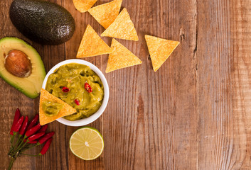 Guacamole dip and nacho chips.