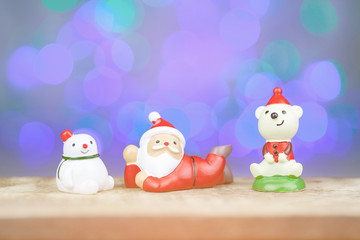 Santa claus and snowman with  bokeh background
