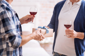 Cute box with present and glasses of wine