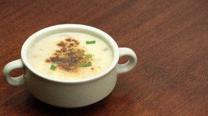 Sweet Apple Cream Soup with Cinnamon on Wooden Table