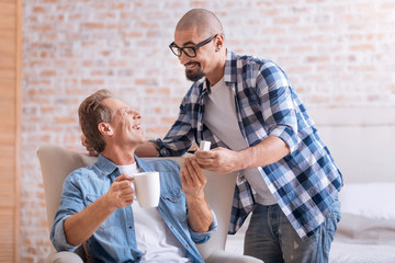 Cheerful young man making the proposal to his aged partner