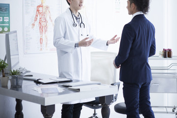 Doctors and businessmen are talking at the hospital