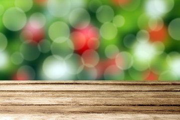 Christmas holiday background with empty wooden table over festiv
