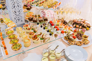 Delicacies, appetizers, wine, desserts at the Banquet. Buffet, catering service. On-site restaurant