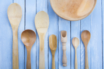 plate wooden spoons kitchen table rustic wooden background
