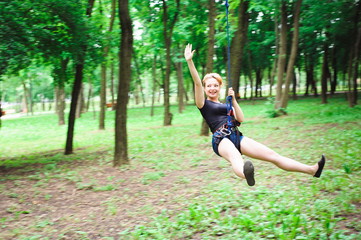 Hiking in the rope park beautiful sports girl