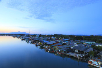 Stock Photo:.Fishing village with evening light .Thailand