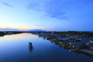 Stock Photo:.Fishing village with evening light .Thailand