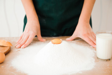 Obraz na płótnie Canvas Chef preparing dough - cooking process
