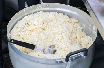 White rice on big bowl, big spoon
