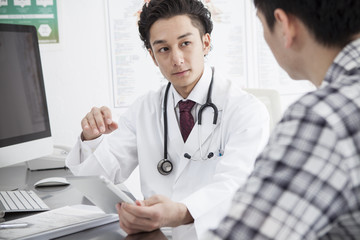 Men are undergoing medical examination at clinic