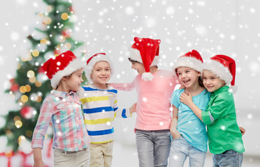 happy little children in christmas santa hats