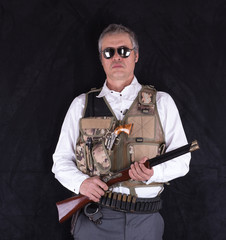 the sheriff in the Wild West with guns, cowboy, studio portrait