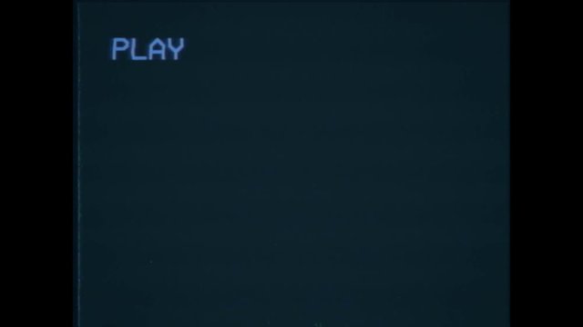 An old damaged VHS tape playing, black screen with PLAY text. A vintage background for videos, a retro element.
