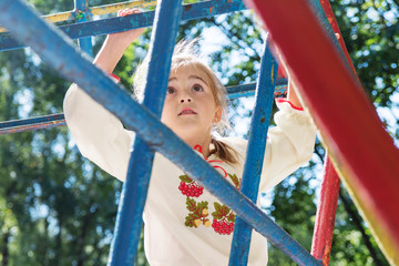 Obraz premium Active little girl on playground