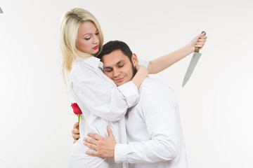 girl holding knife traitor. man with rose in his hand.