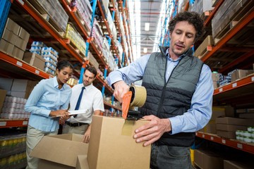 Warehouse workers preparing a shipment
