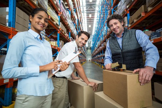 Portrait of warehouse workers preparing a shipment