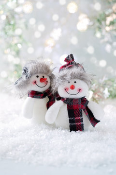 Two funny Snowmen . Christmas background. Christmas card.