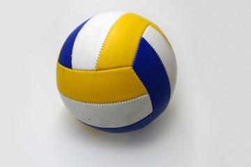 Blue and yellow volleyball ball on a white background