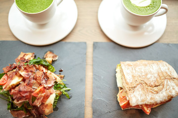 salad, sandwich and matcha green tea at restaurant