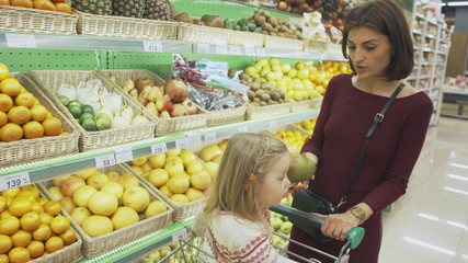 Family makes purchases in the supermarket