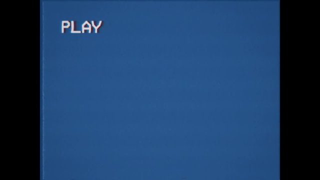 An old damaged VHS tape playing, blue screen with PLAY text. A vintage background for videos, a retro element.
