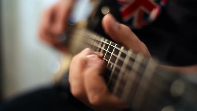 Guitarist Playing On Electrical Guitar. Close Up