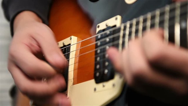 Musician Plays Rock Music On Electrical Guitar